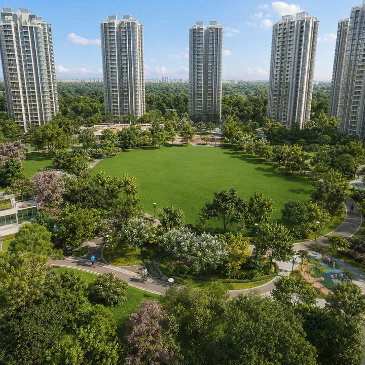 Godrej Whitefield central landscaped green spine with walkways and seating courts threading between the towers